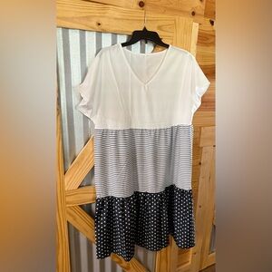 New Dress. Polyester Nylon Blend. 40.5” length and 21” across chest. Lightwght